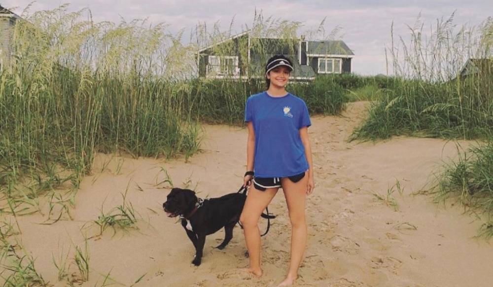 Image of Anna Shah &rsquo;22 with Bubba, an American Staffordshire Terrier Photo courtesy of Anna Shah &rsquo;22
