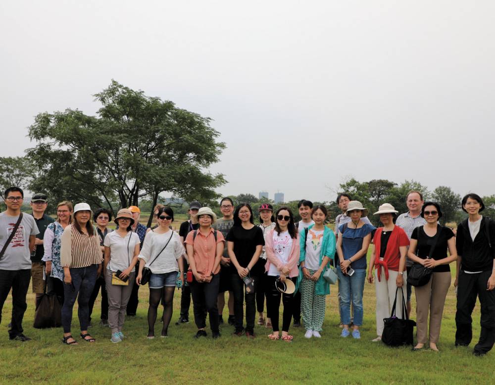 Prof. Yan Sun (front row, fourth from right) in August 2018 with Xiyang Duan &rsquo;17 at an archaeological site