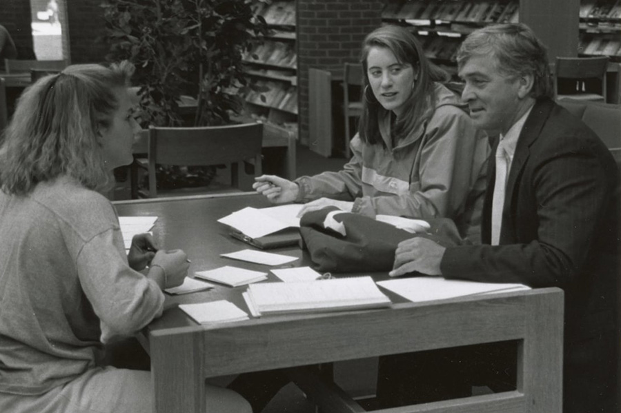 President Gordon Haaland at the library with students