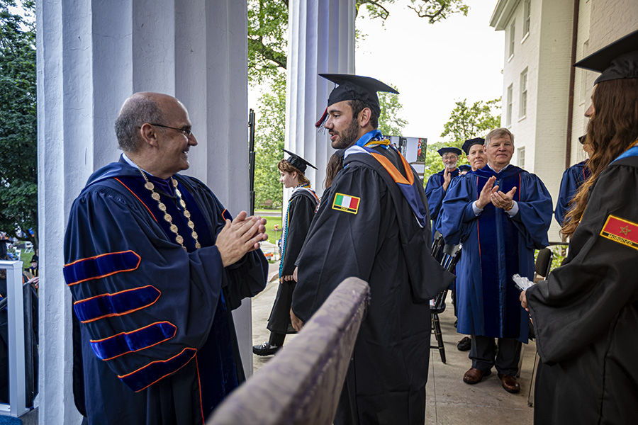 President Luliano greets graduates