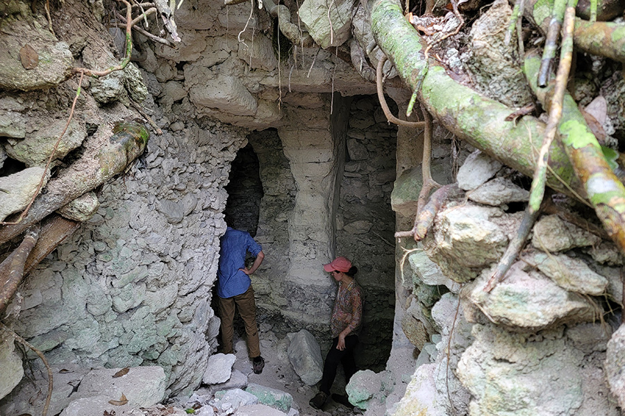 An image of an entrance into a looters trench at Ayiin Winik