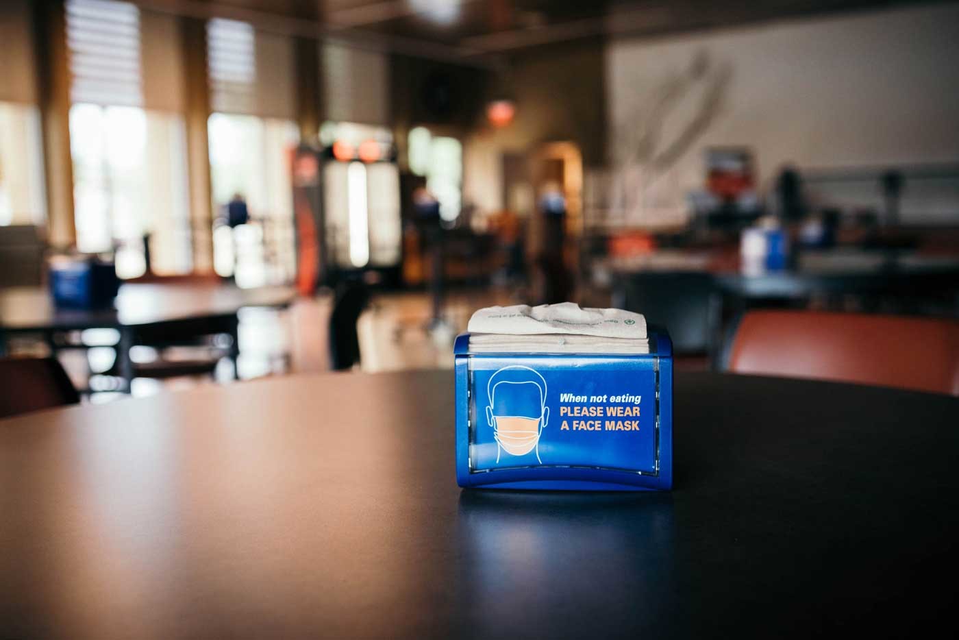 napkin holder in the Atrium reminds &lsquo;When not eating, please wear a face mask&rsquo;